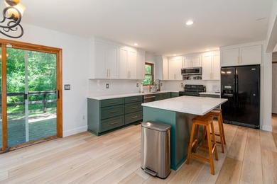 Tucked away on a peaceful one-acre wooded lot, this 4-bedroom, 3 - photo 11