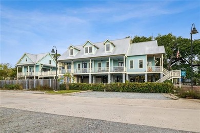 Steps from the lakefront in the heart of Old Mandeville, this