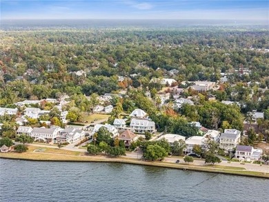 Steps from the lakefront in the heart of Old Mandeville, this