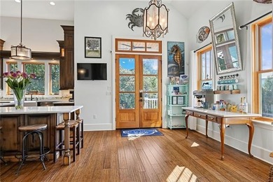 Steps from the lakefront in the heart of Old Mandeville, this