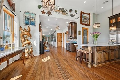 Steps from the lakefront in the heart of Old Mandeville, this