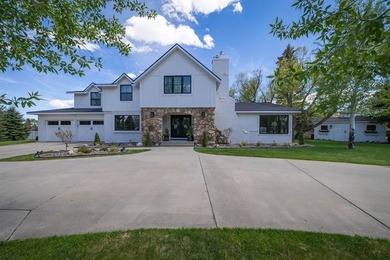 Nestled on a beautifully landscaped half-acre lot in one of - photo 1