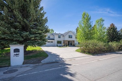 Nestled on a beautifully landscaped half-acre lot in one of - photo 6
