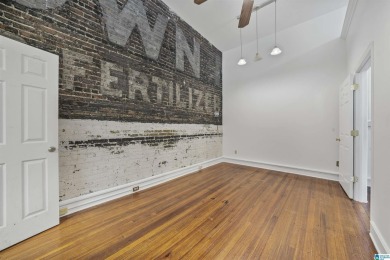 Exposed brick wall, floor to ceiling windows, exposed cedar