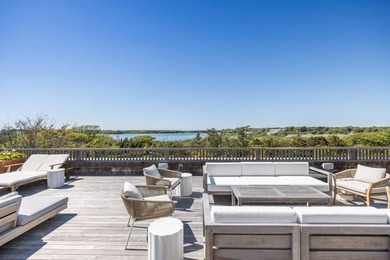 Nestled between the Atlantic Ocean and Georgica Pond lies a - photo 26