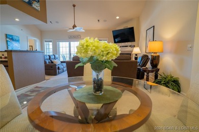 Elevate your Lake lifestyle in this premier Top Floor residence