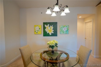 Elevate your Lake lifestyle in this premier Top Floor residence