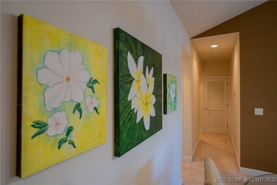 Elevate your Lake lifestyle in this premier Top Floor residence