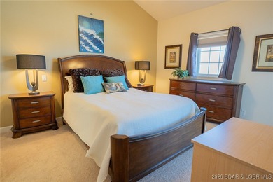 Elevate your Lake lifestyle in this premier Top Floor residence