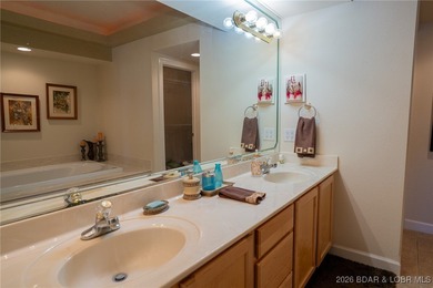 Elevate your Lake lifestyle in this premier Top Floor residence