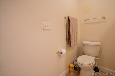 Elevate your Lake lifestyle in this premier Top Floor residence