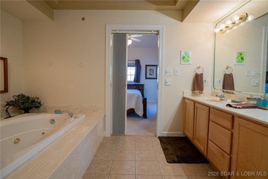 Elevate your Lake lifestyle in this premier Top Floor residence