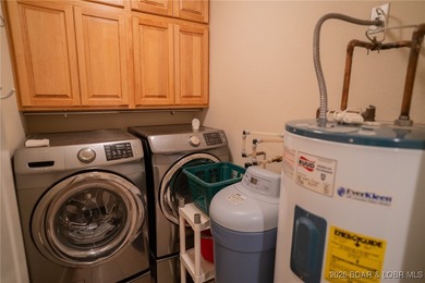 Elevate your Lake lifestyle in this premier Top Floor residence