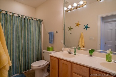 Elevate your Lake lifestyle in this premier Top Floor residence