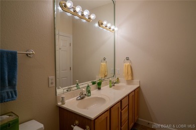 Elevate your Lake lifestyle in this premier Top Floor residence