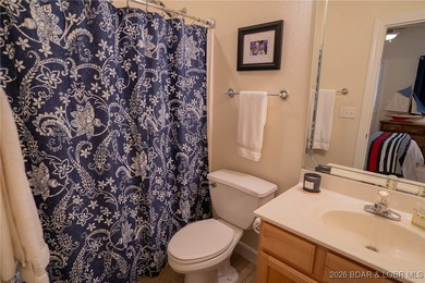 Elevate your Lake lifestyle in this premier Top Floor residence