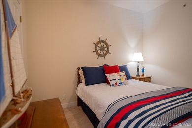 Elevate your Lake lifestyle in this premier Top Floor residence