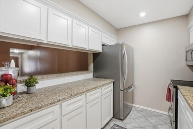 Welcome to this charming townhome located in the highly - photo 11