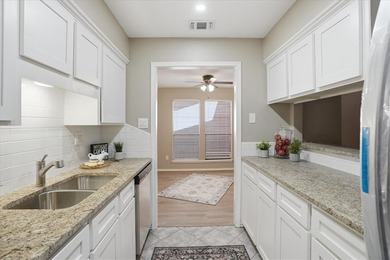 Welcome to this charming townhome located in the highly - photo 12