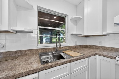 TOTALLY RENOVATED! NEW metal roof. NEW custom kitchen. NEW AC - photo 15