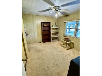 Welcome to this charming three-bedroom, two-bathroom mobile home - photo 14