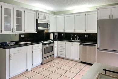 Enjoy comfortable Florida living in this bright and spacious - photo 4
