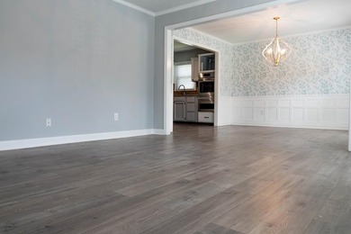 Price Adjustment! Welcome to this thoughtfully renovated - photo 5
