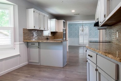 Price Adjustment! Welcome to this thoughtfully renovated - photo 6