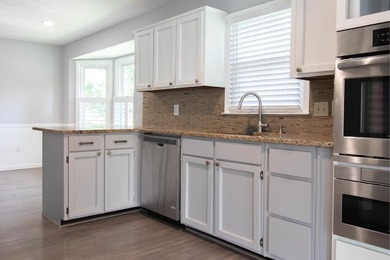 Price Adjustment! Welcome to this thoughtfully renovated - photo 8