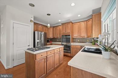 Welcome to this beautifully maintained end-unit townhome in the - photo 2