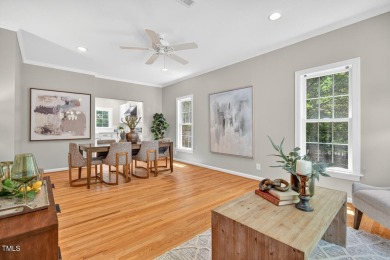 Tucked away on a tree-lined lot with fenced yard, this