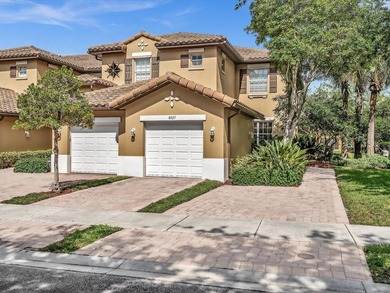 Nestled in the gated community of Heron Bay in Parkland, this - photo 3