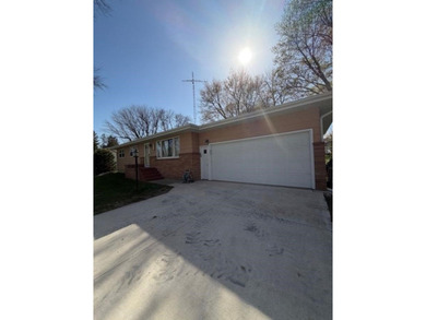 This home features a 2-car attached garage and a thoughtfully - photo 6