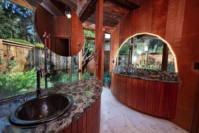 This oceanside sanctuary is set on a private forested promontory - photo 12