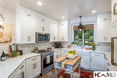 On the shores of Lake Glenville, Deer Run Cottage emerges as - photo 12