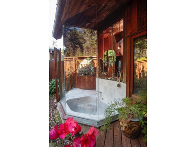 This oceanside sanctuary is set on a private forested promontory - photo 14