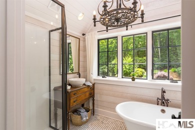 On the shores of Lake Glenville, Deer Run Cottage emerges as - photo 33