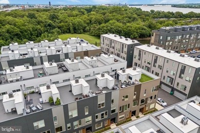 Experience modern riverfront living at its finest in one of - photo 43