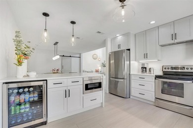 This Boca Lago Villa is completely renovated in every way and