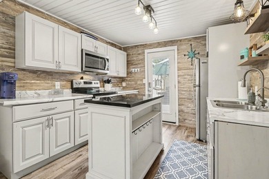 This charming 2-bedroom, 1-bath cottage in Bangor offers access - photo 8