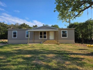 Lake Home For Sale in Pelican Bay, Texas
