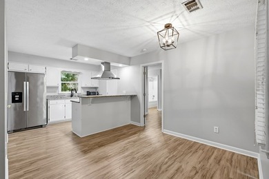 Quaint country living with this remodeled 4BR 2BA home sitting - photo 7