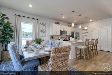 The Lawrence is a thoughtfully designed one-story home featuring - photo 11