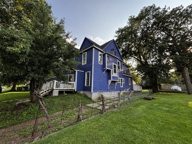 Own a piece of history in River Bend! This early 1900s Victorian