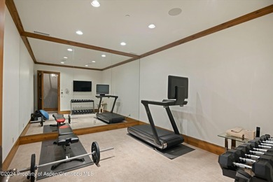 Located in the exclusive Maroon Creek Club, this timeless - photo 28