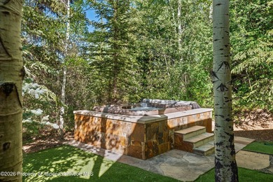 Located in the exclusive Maroon Creek Club, this timeless - photo 41