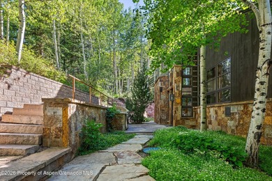 Located in the exclusive Maroon Creek Club, this timeless - photo 43