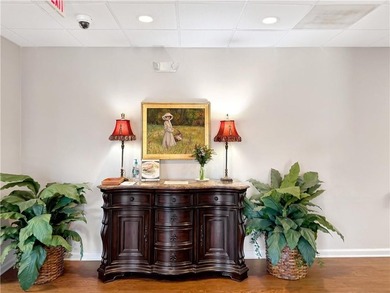 WALK-IN TUB and gleaming hardwoods and washer/dryer in unit in