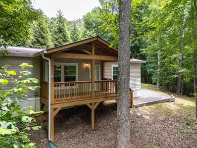 Enjoy easy country living nestled among the trees on 1.5 wooded - photo 1