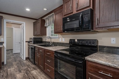Enjoy easy country living nestled among the trees on 1.5 wooded - photo 10